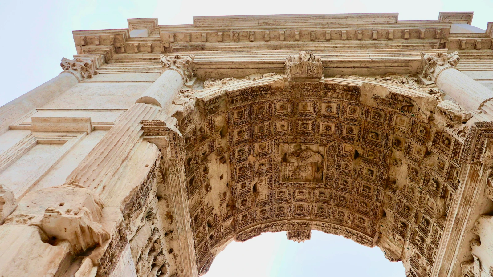 Looking up at the Arch of Constantine in Rome - explore Roman monuments by hire car